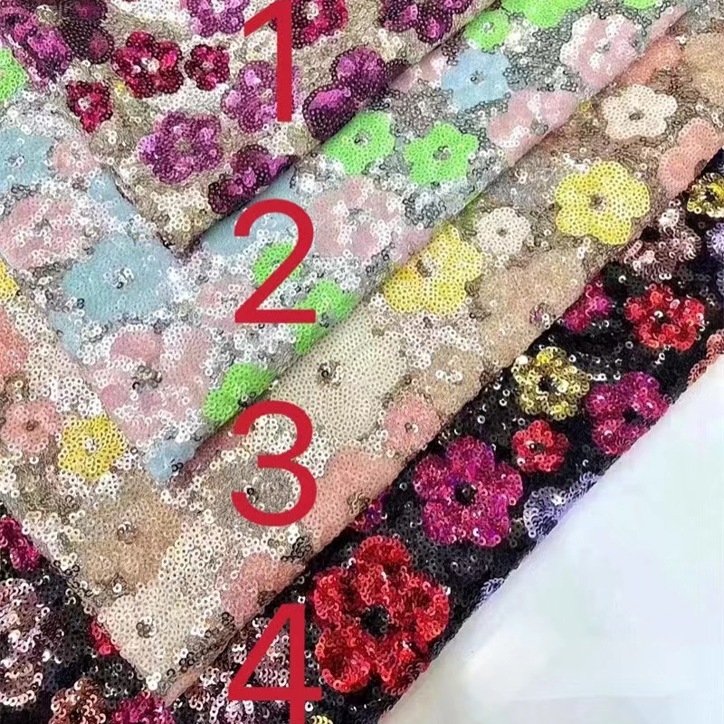 Il grossista in pizzo svela un nuovo tessuto di paillettes per costumi da ragazza e donna